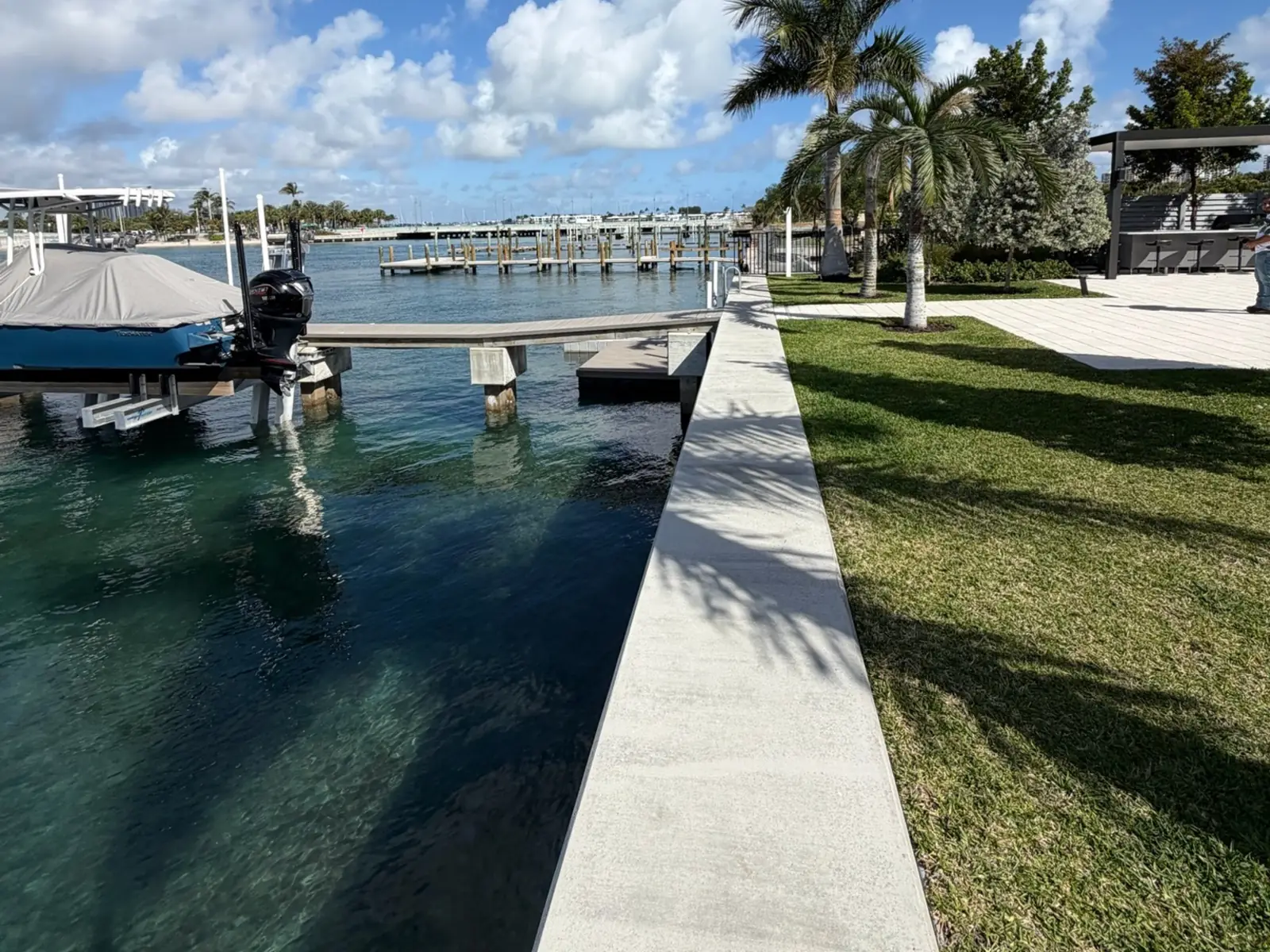 Concrete seawall cap running along a residential canal in South Florida