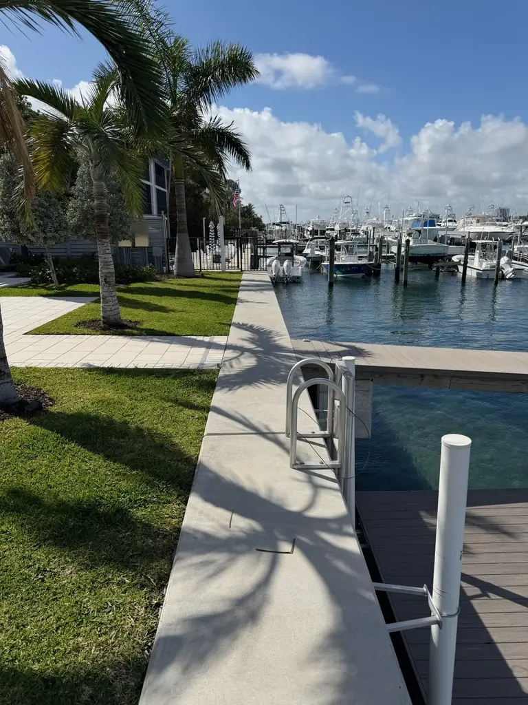 Repaired concrete seawall and cap on a residential canal