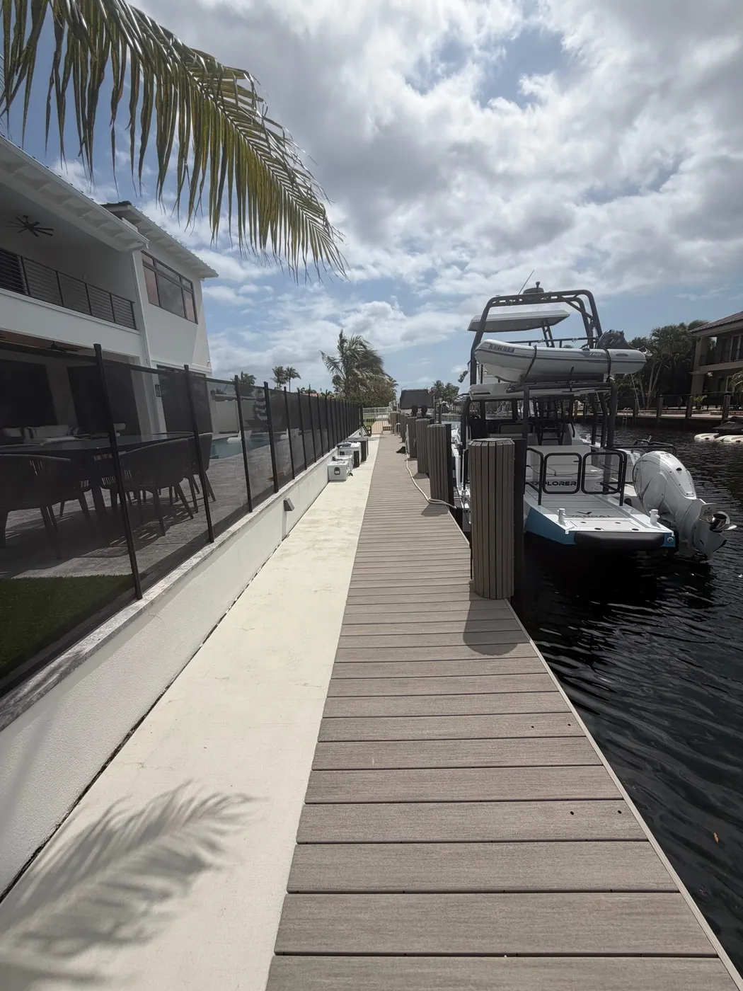 Full seawall and dock replacement, Deerfield Beach FL — new seawall with composite dock walkway and boat lift.
