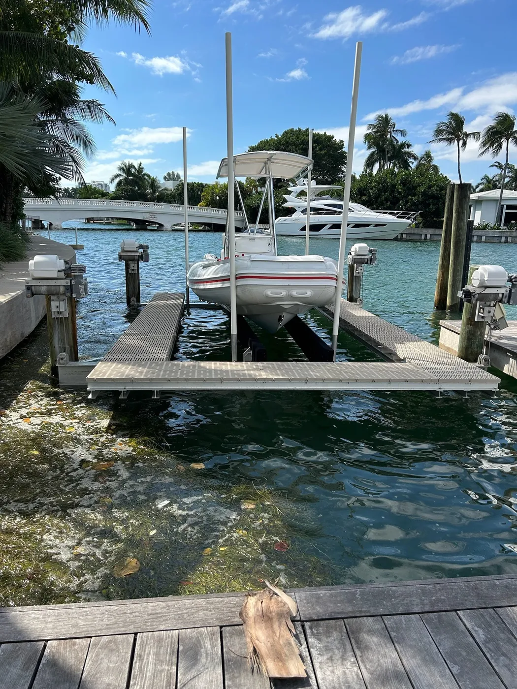 Elevator-style boat lift along a narrow canal