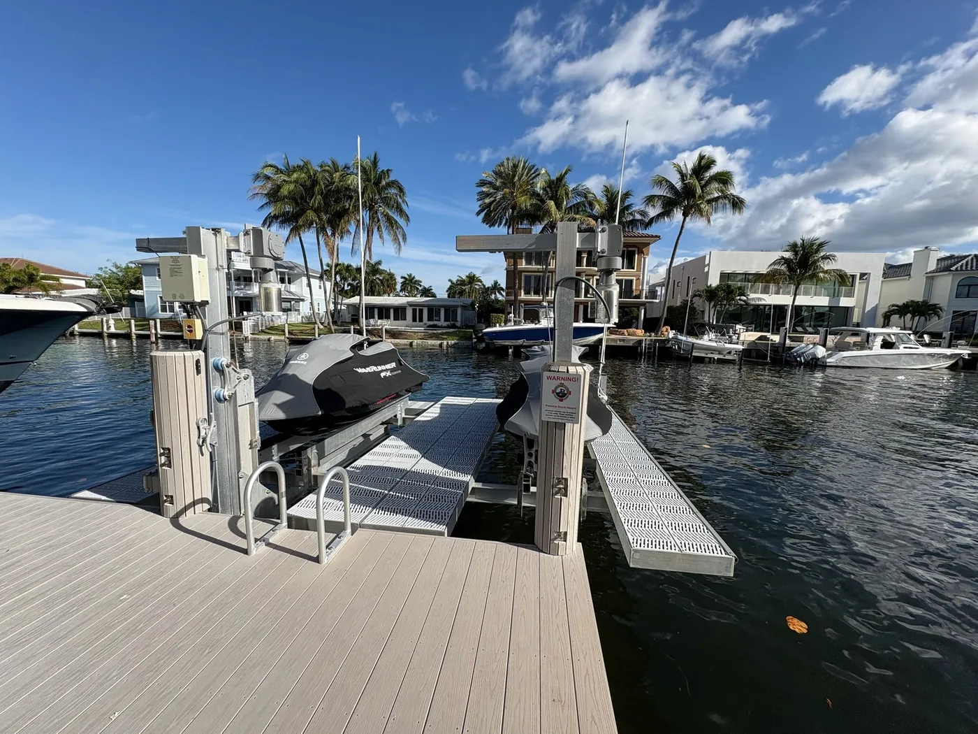 Custom dock with boat slips on a South Florida canal