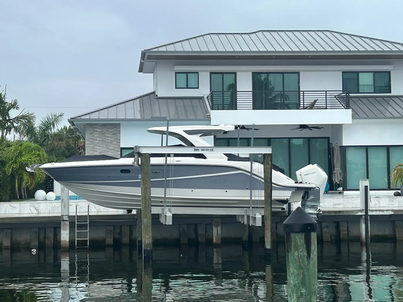 Center console boat on a four-post boat lift