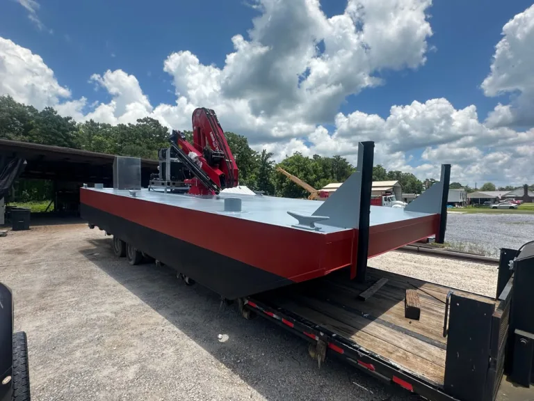 South Florida Seawall's 30-foot steel deck barge fitted with an AMCO 810 crane